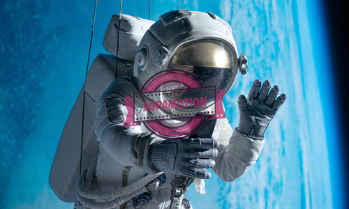 Caucasian female astronaut stuntwoman hanging on a wires, wearing a spacesuit