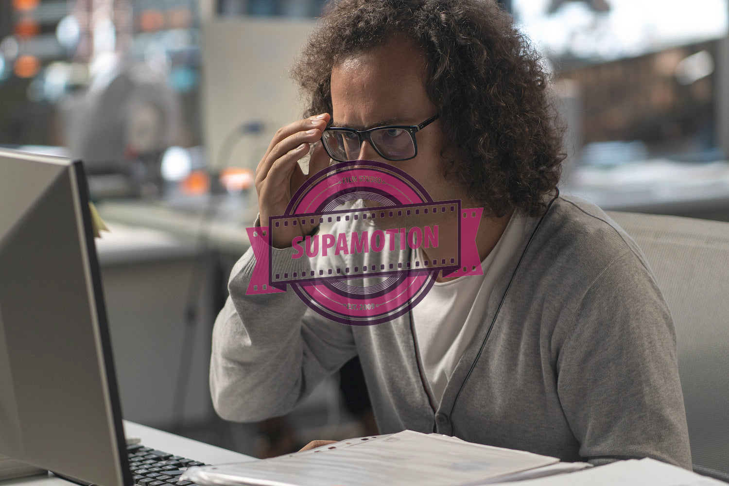 Portrait of nerdy office worker Caucasian male concentrated on a given task