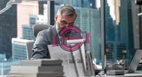 Portrait of 50s adult Caucasian businessman signing documents in his office