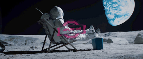 Lunar astronaut having a beer while resting in a beach chair on Moon surface