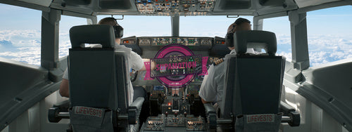 Commercial aircraft pilots controlling the plane during flight at high altitude