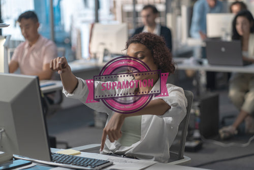 Bored African American female employee silly typing on keyboard at working desk