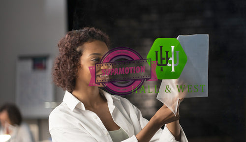 Portrait of African American entrepreneur applying sticker with her company name