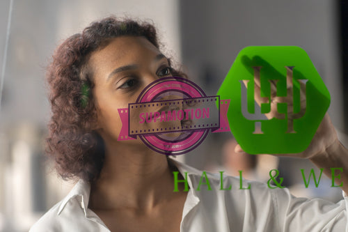 Portrait of African American entrepreneur applying sticker with her company name