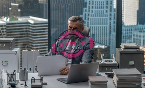 Portrait of 50s adult Caucasian businessman working at his desk in the office