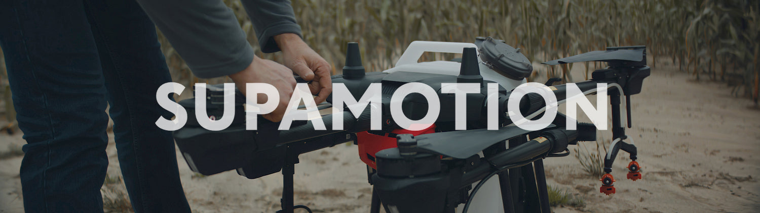 Male farmer preparing his huge intelligent agriculture drone for a flight