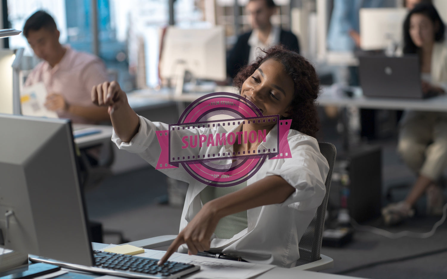 Bored African American female employee silly typing on keyboard at working desk