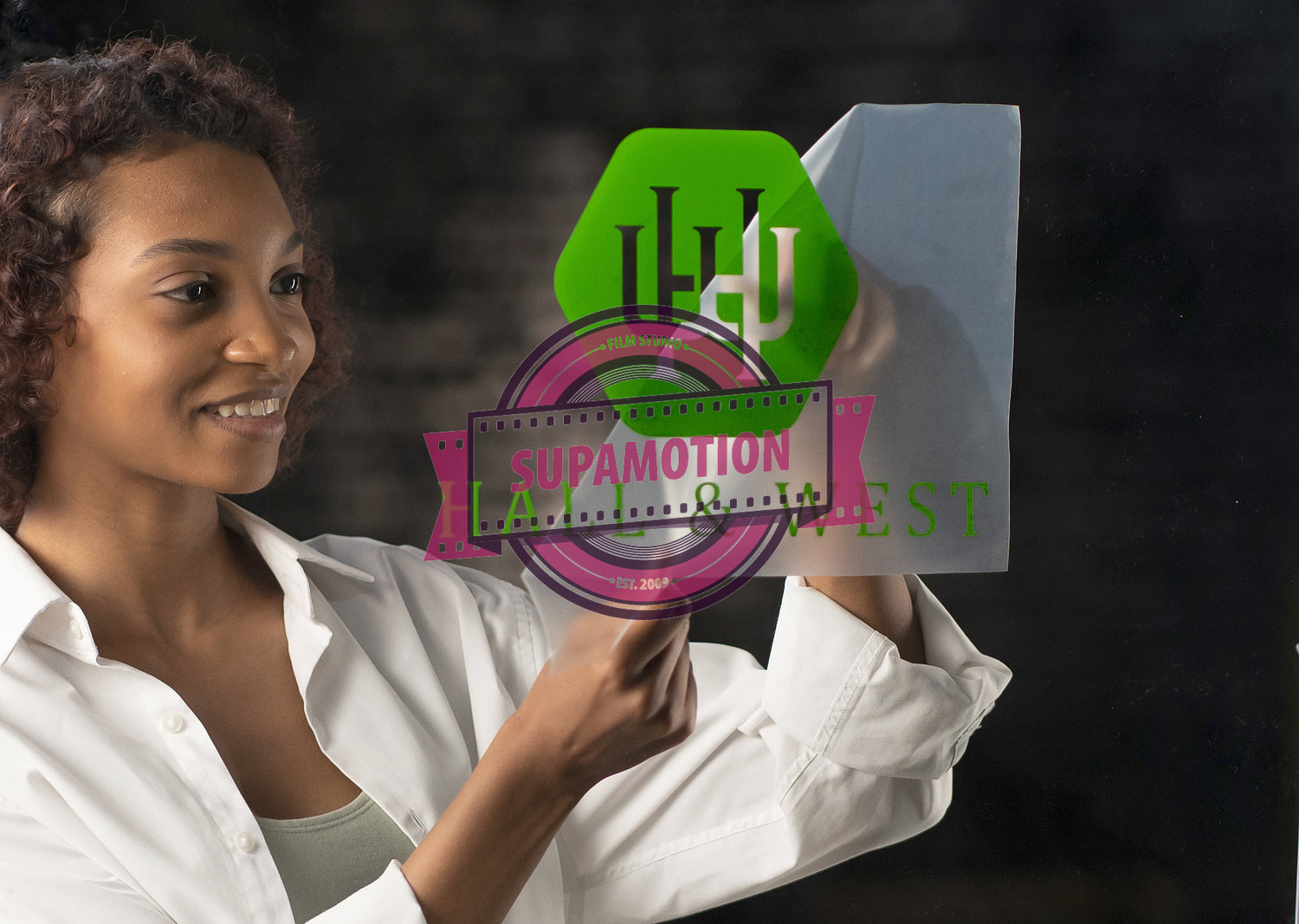 Portrait of African American entrepreneur applying sticker with her company name