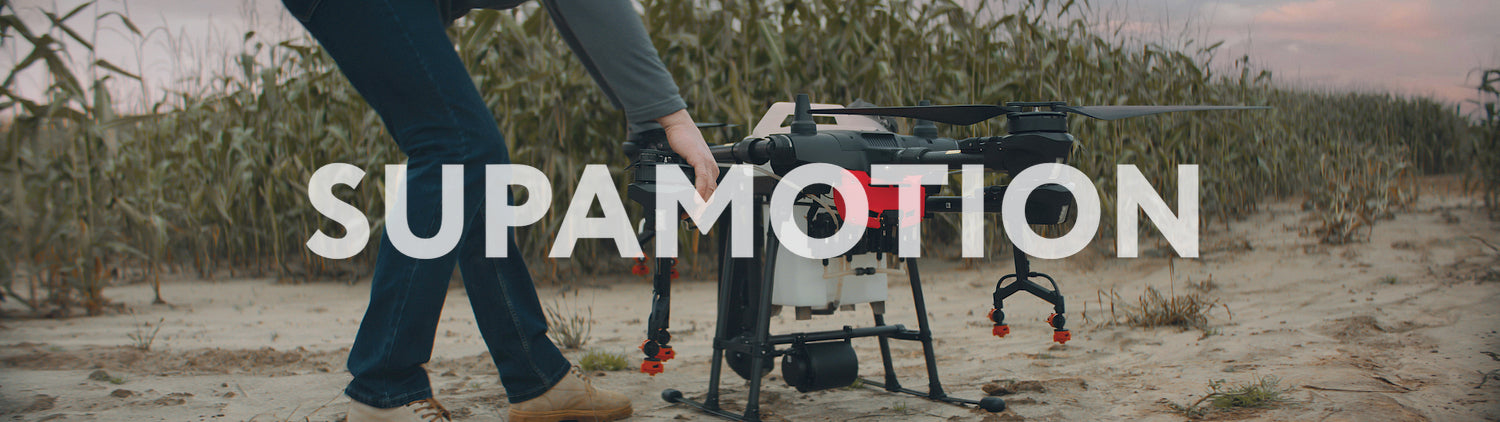 Male farmer preparing his huge intelligent agriculture drone for a flight