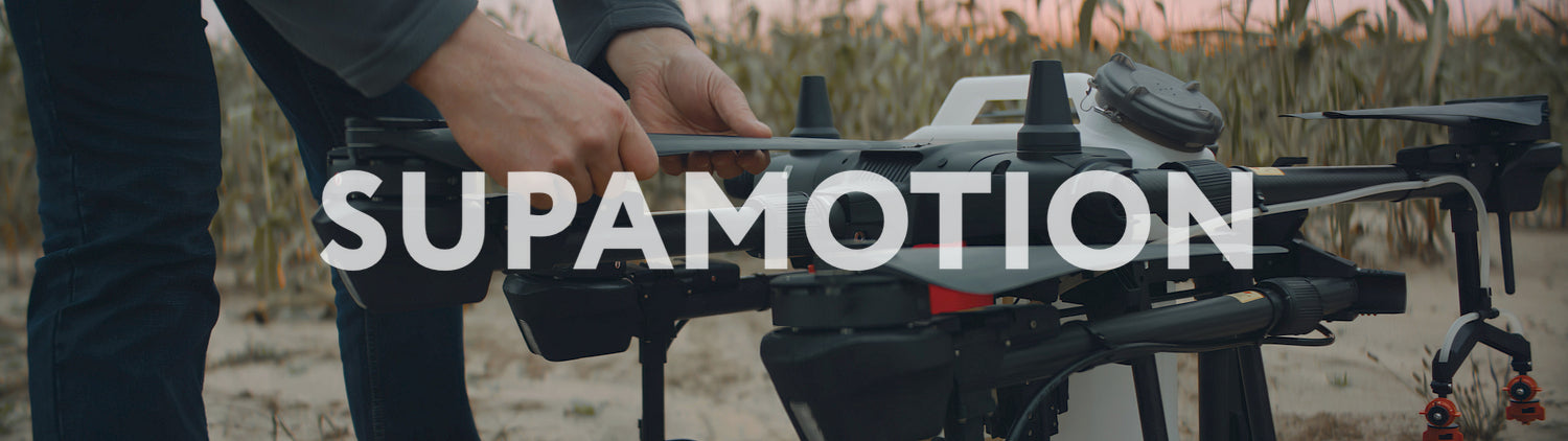 Male farmer preparing his huge intelligent agriculture drone for a flight